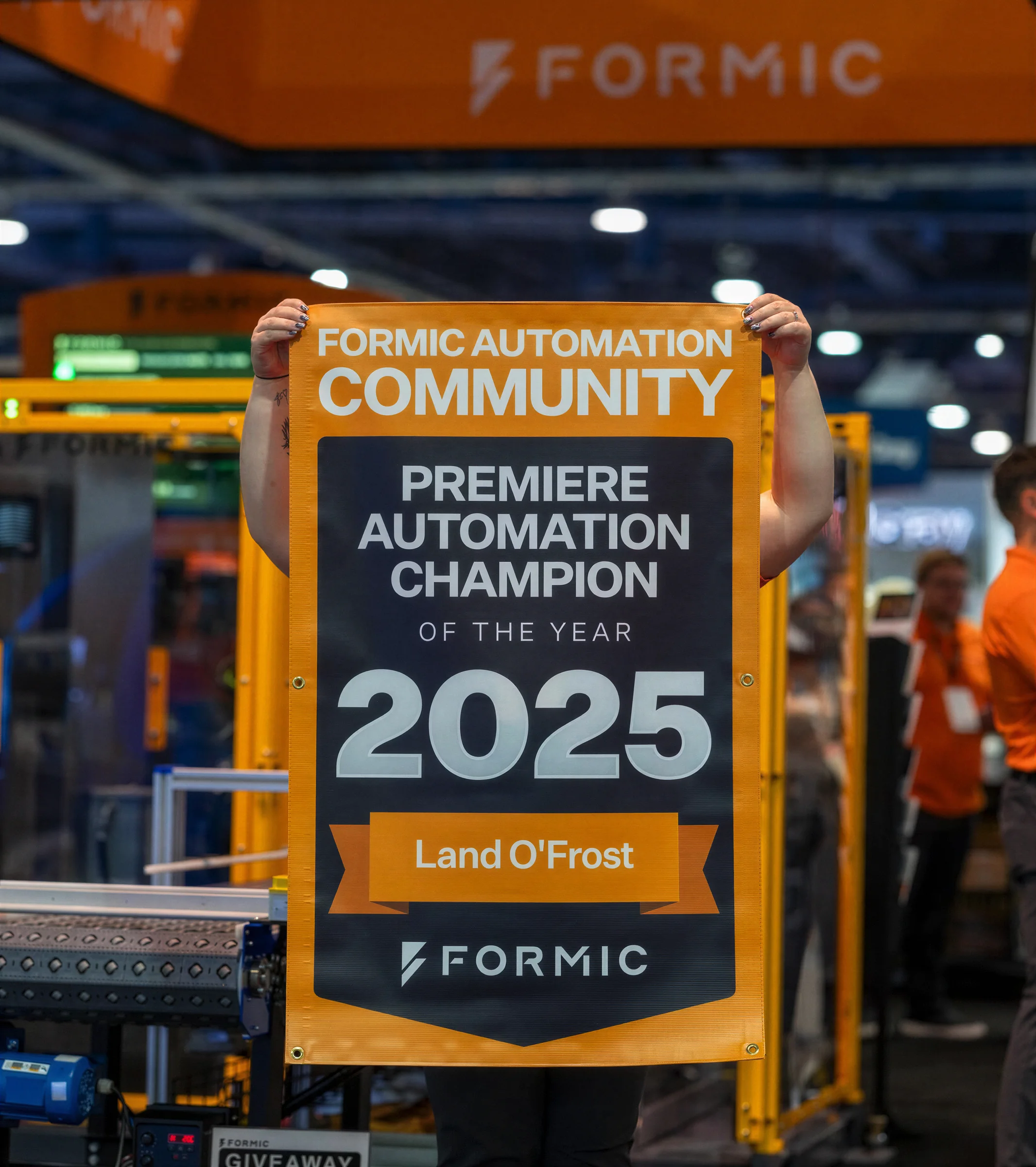 Formic award banner held up at a trade show